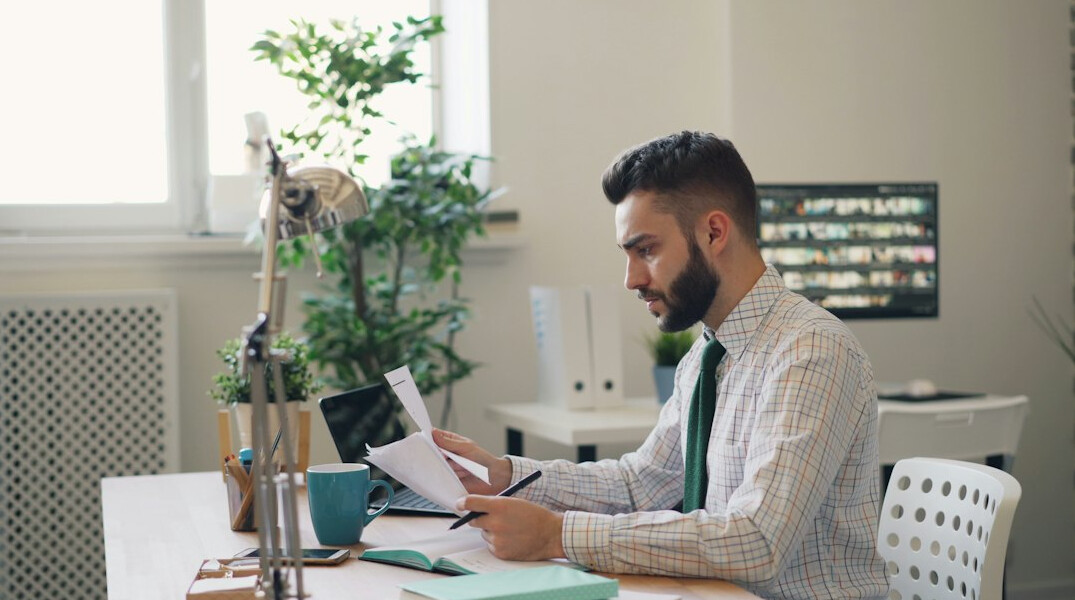 person budgeting at desk