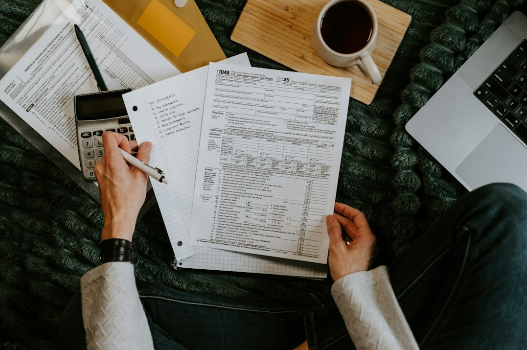 person studying financial charts