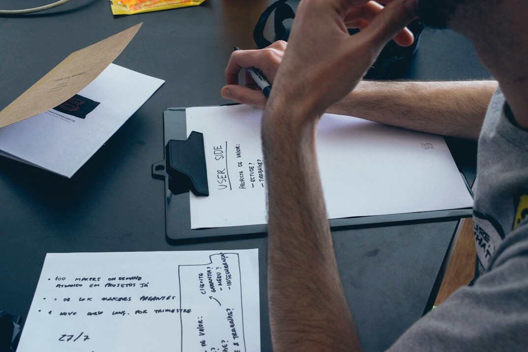 person studying financial charts