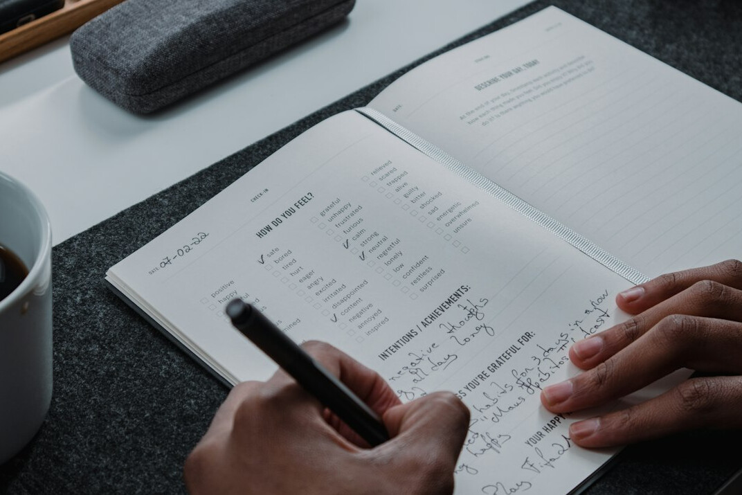 person writing financial goals